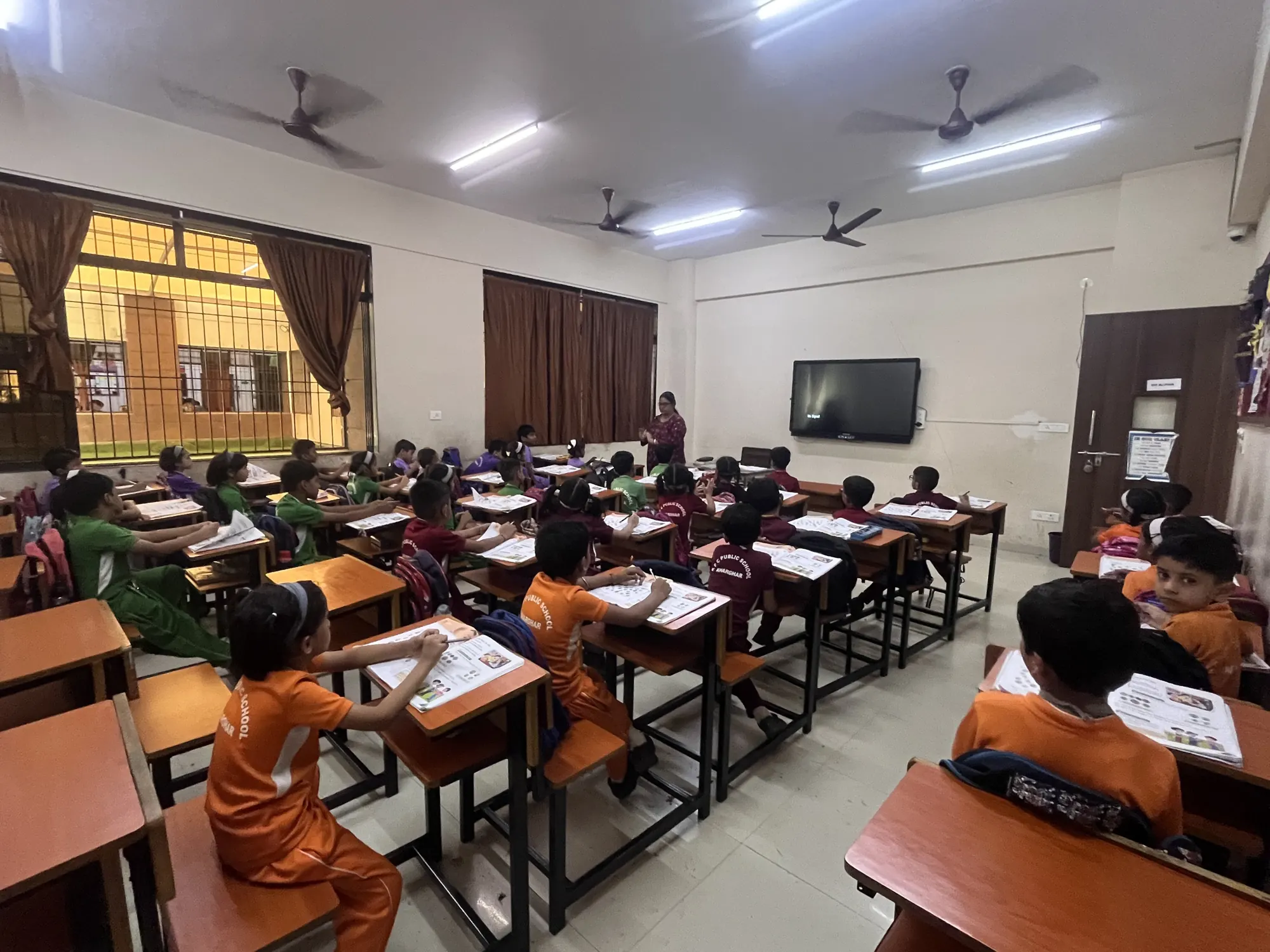 Students at their desks in a KPC classroom