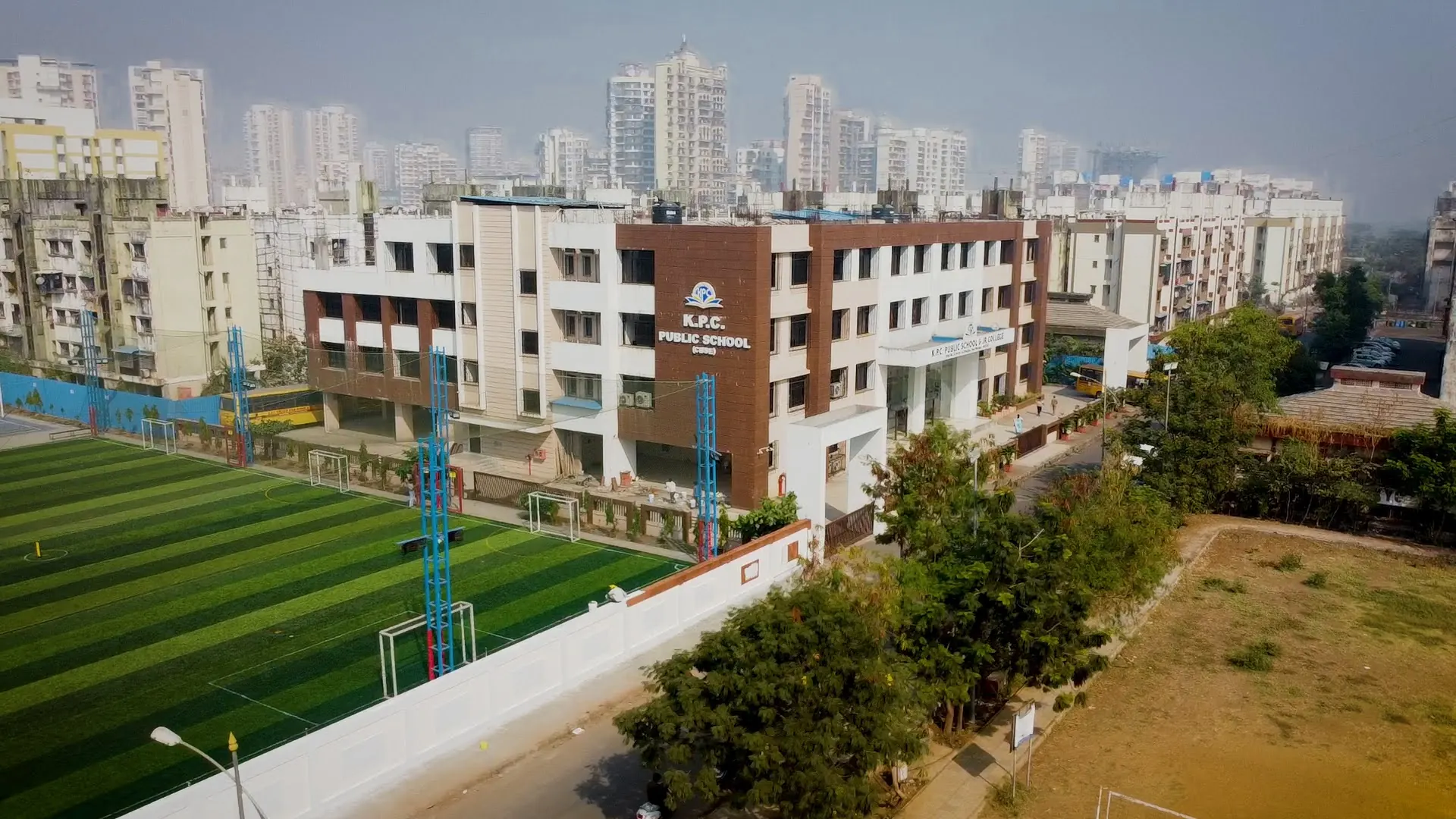 The KPC campus from above: the school building and the football turf