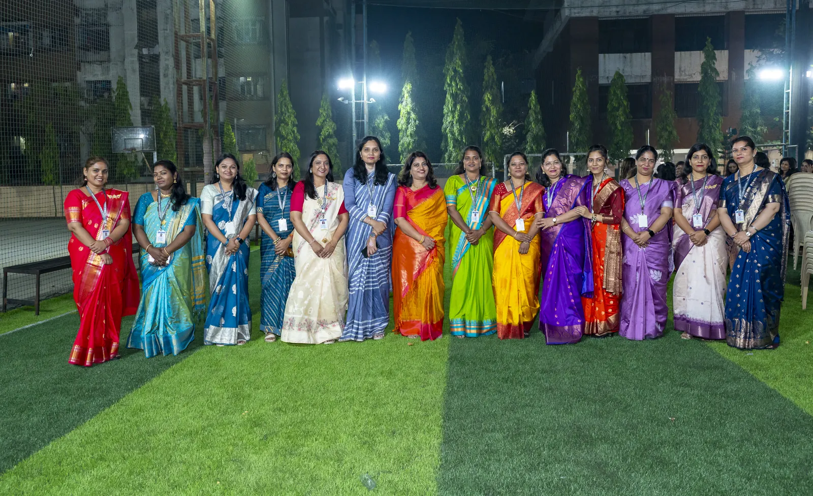 KPC teachers in saris on the turf at Annual Day